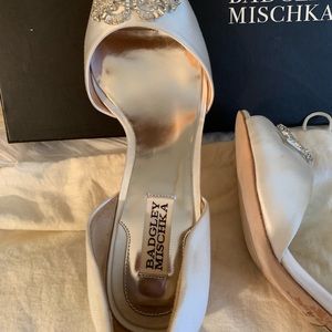 White Satan open-toe shoe.